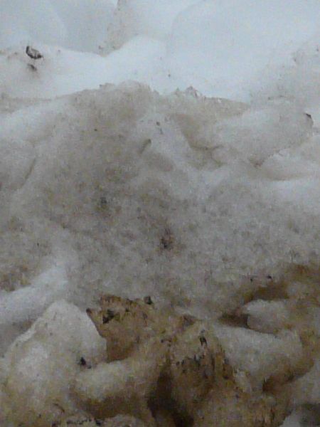 Dirty snow texture, formed into large irregular clumps.